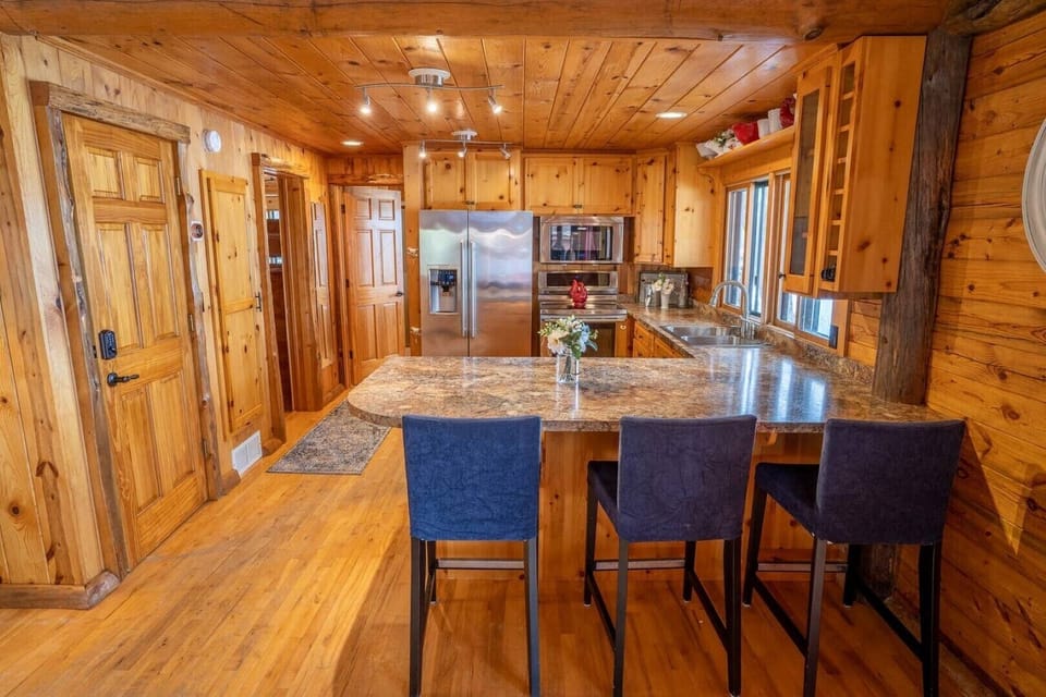 Main floor - Kitchen with SS appliances and oversized peninsula.