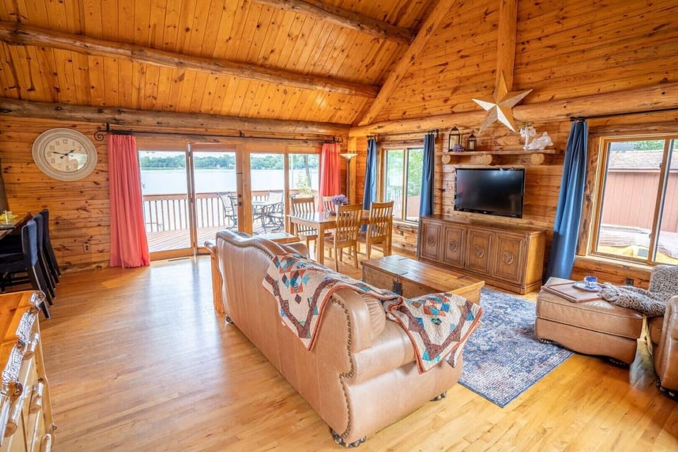 Main floor - open area living & dining room walks out to deck overlooking lake.