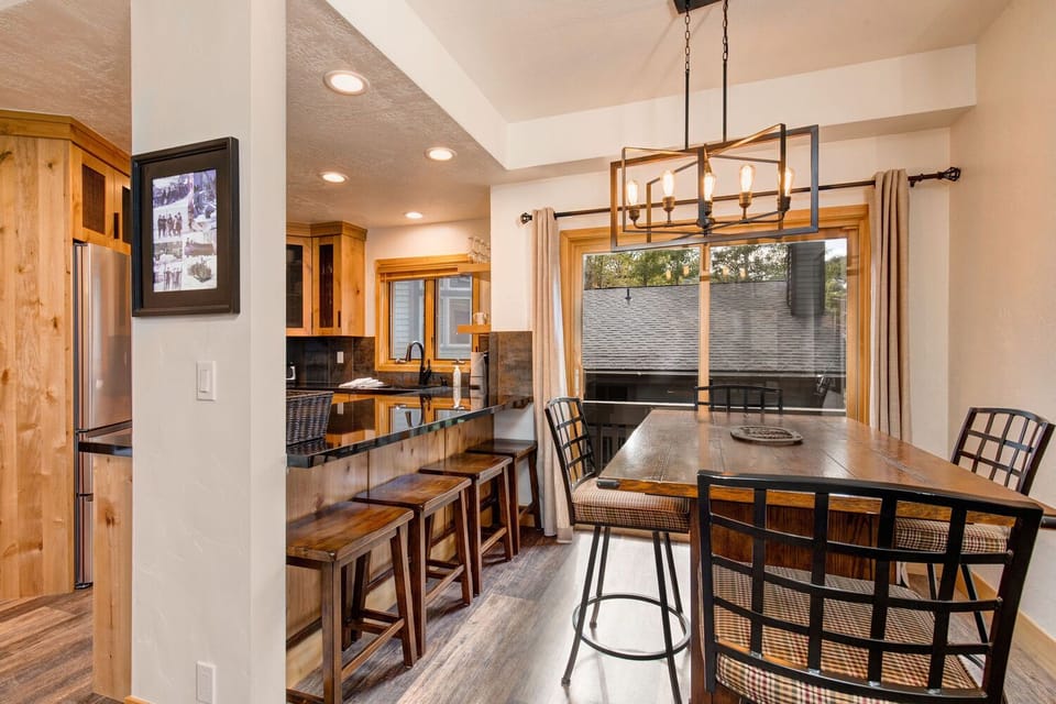 Dining Area with Seating for Four and a Juliette Balcony with Views of Old Town and Park City Ski Slopes