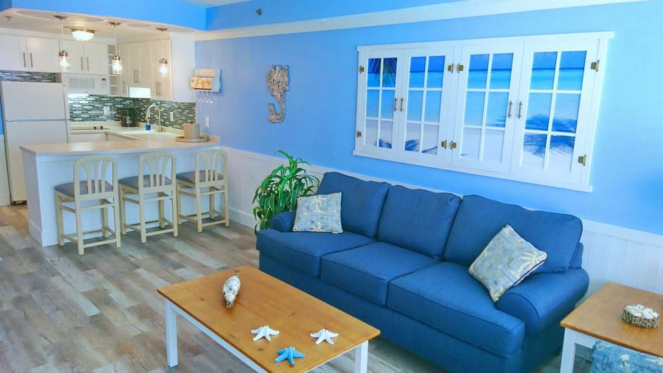 LIVING AREA: Sofa - Breakfast Bar - Kitchen