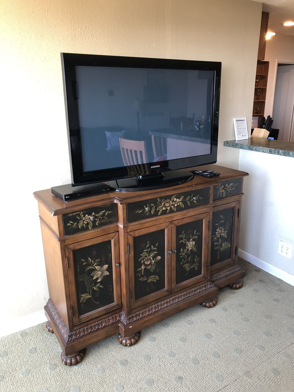 Upper big screen tv with smart DVD player, movies & CDs and  a wireless speaker
