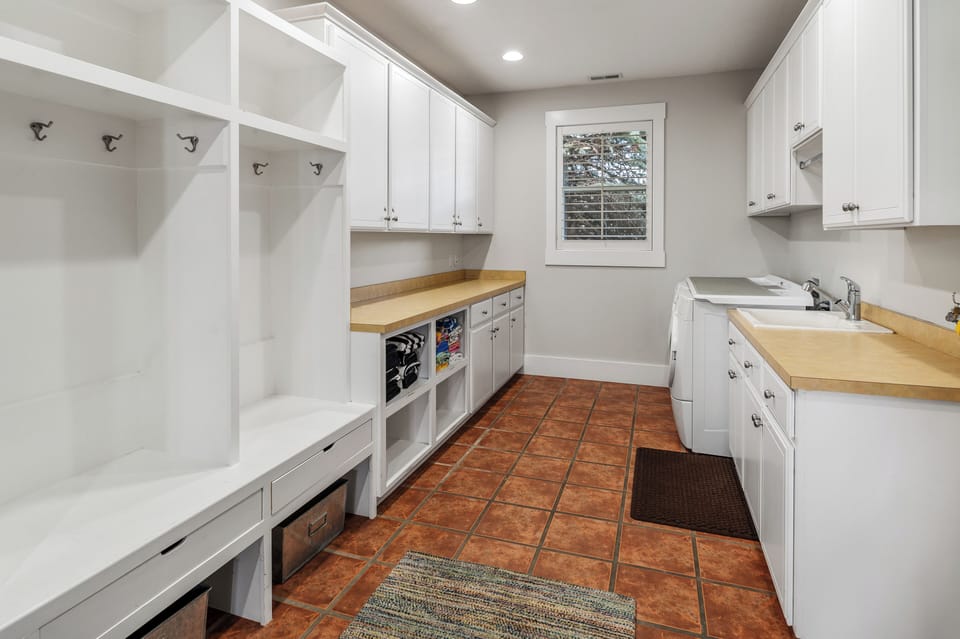 Main floor mud room with storage for every season.