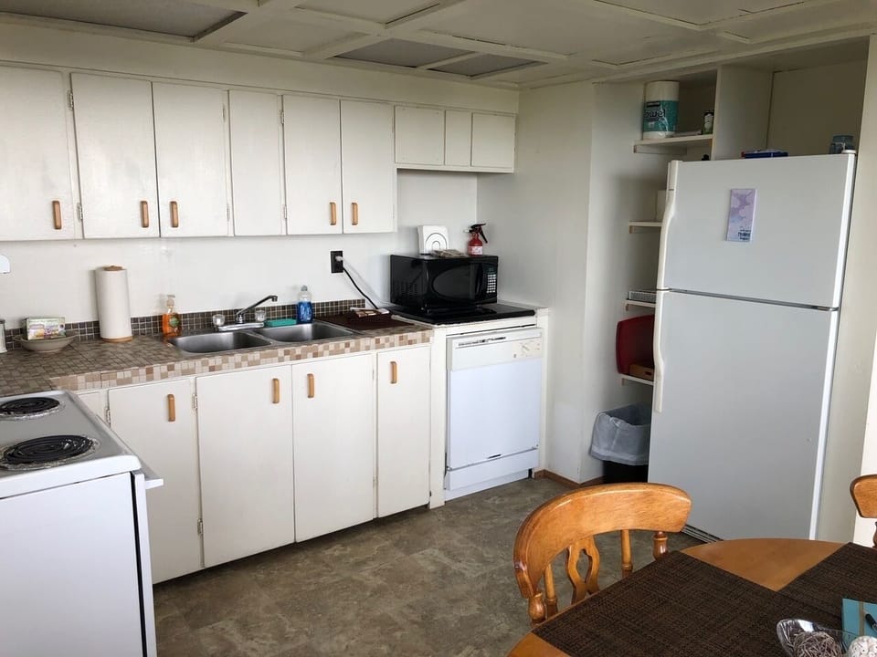 Well stocked kitchen inc spices, coffee, tea, condiments, full size refrigerator