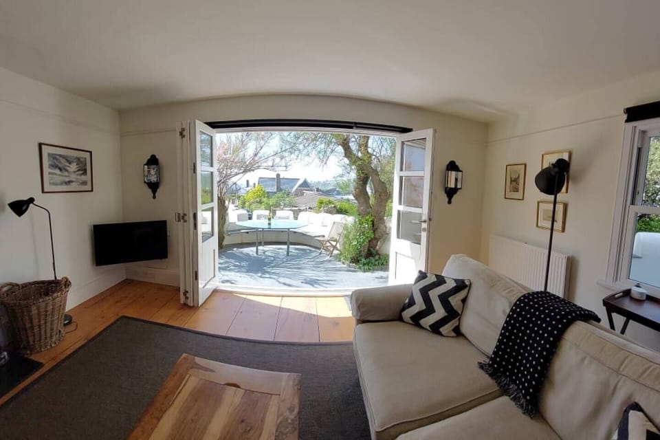The sunny patio is easily accessed from the living room creating an outdoor feel on warm summer days