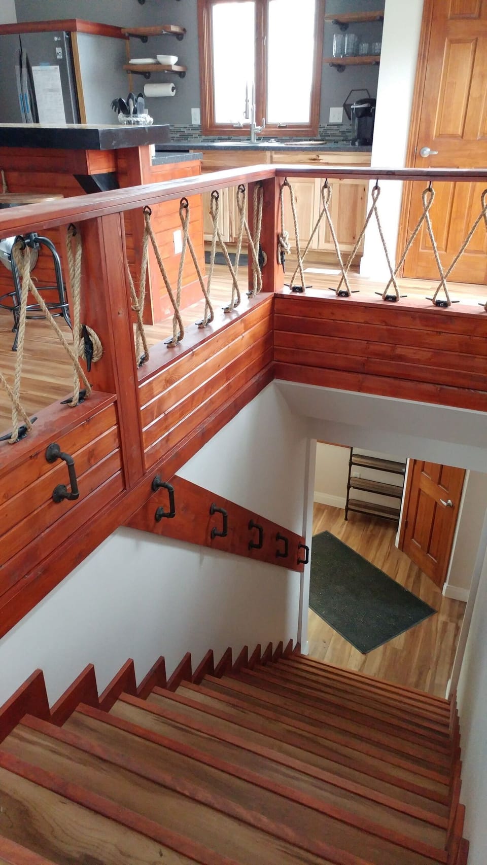 Enter on the ground floor, this unique staircase leads to the main level.