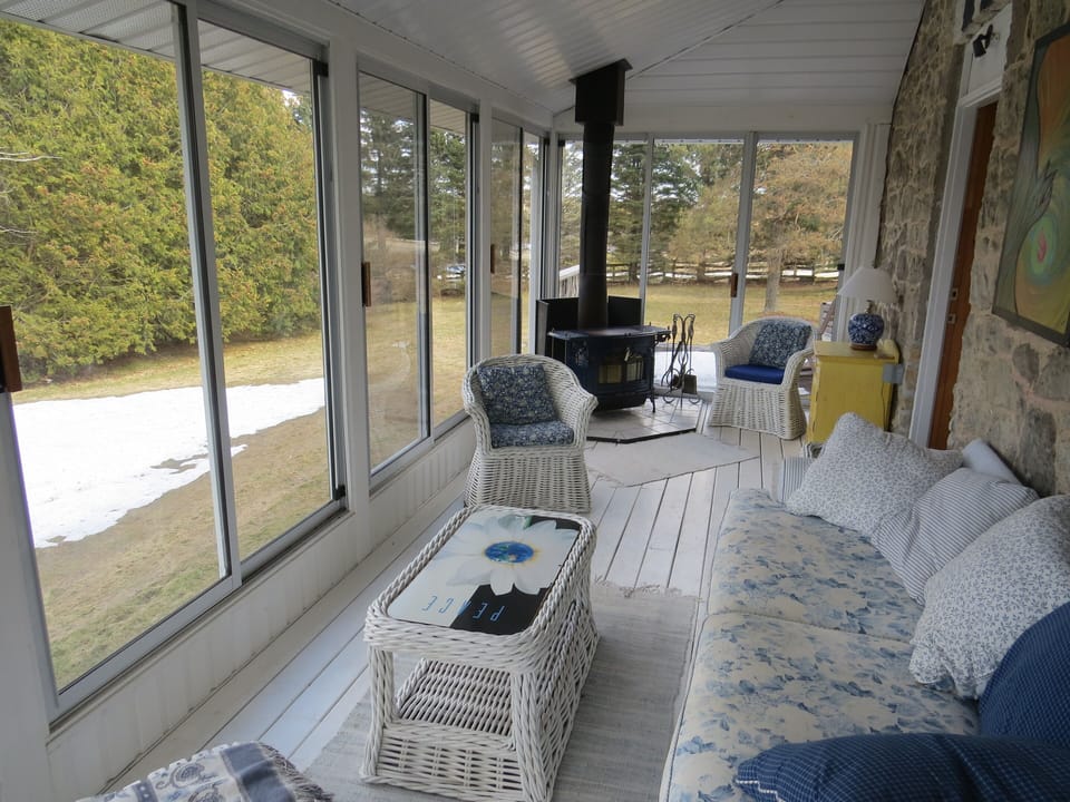 The screened porch in the main house is an absolute delight to relax.