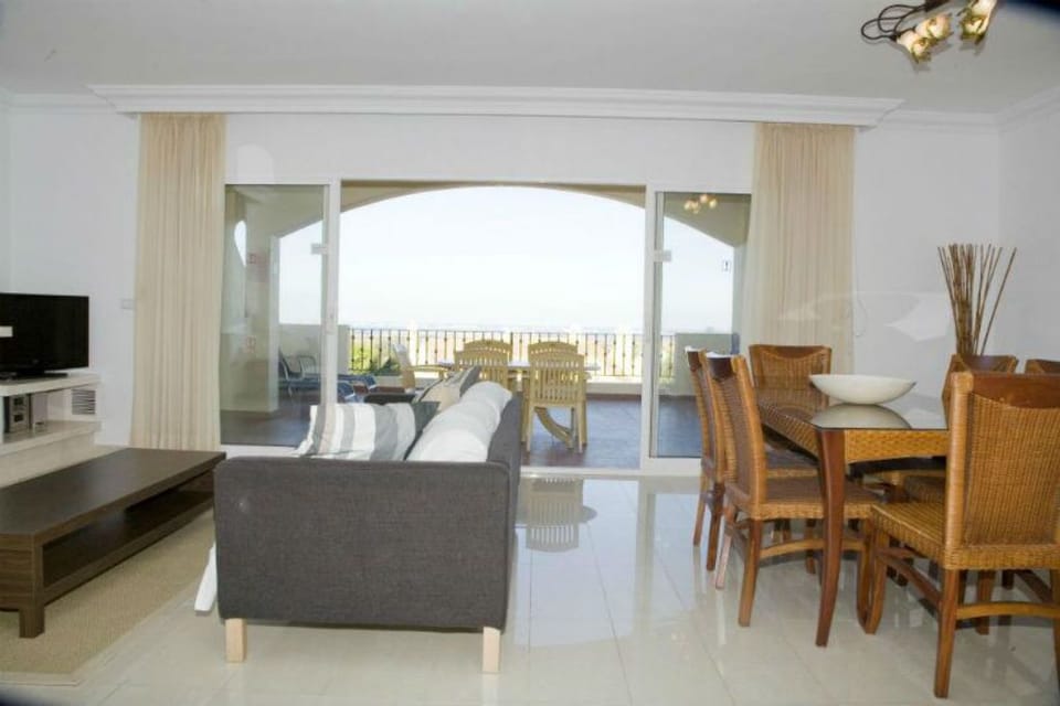Doors Lead Onto The Spacious Terrace With Breath Taking Views & Dining Furniture