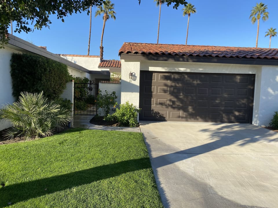 Front entry, 2 car garage for renter's use and a gated front courtyard.