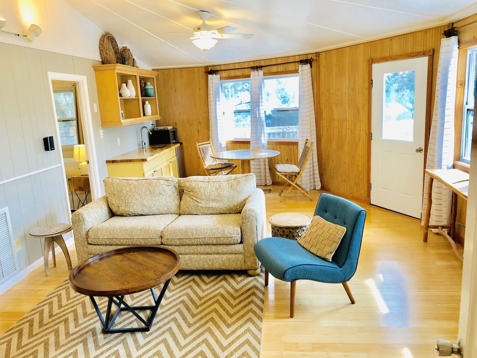 Second living space (great room) with TV, small dining area and wet bar 