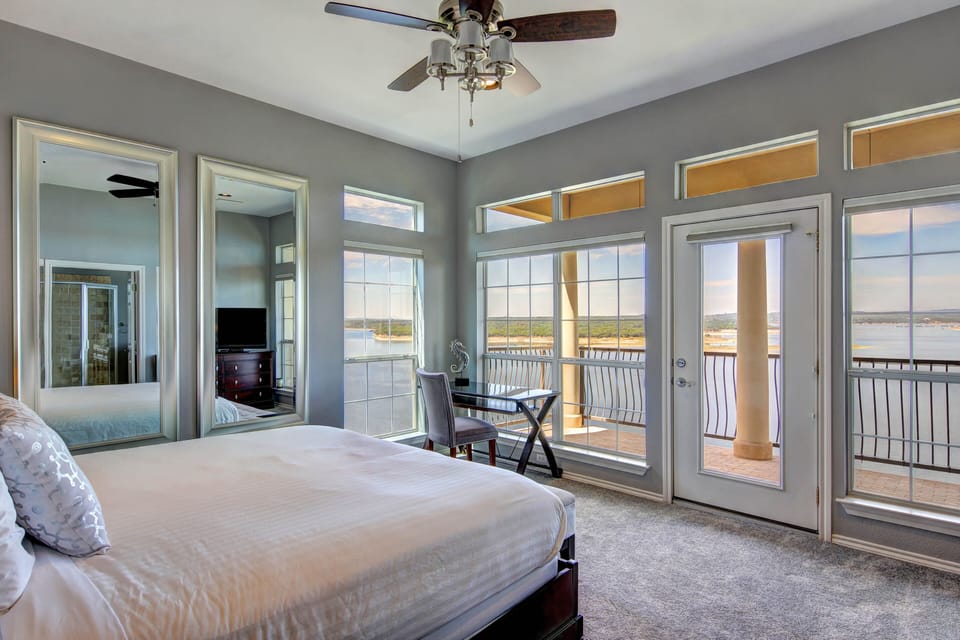 MASTER BEDROOM WITH BED FACING PRIVATE BALCONY