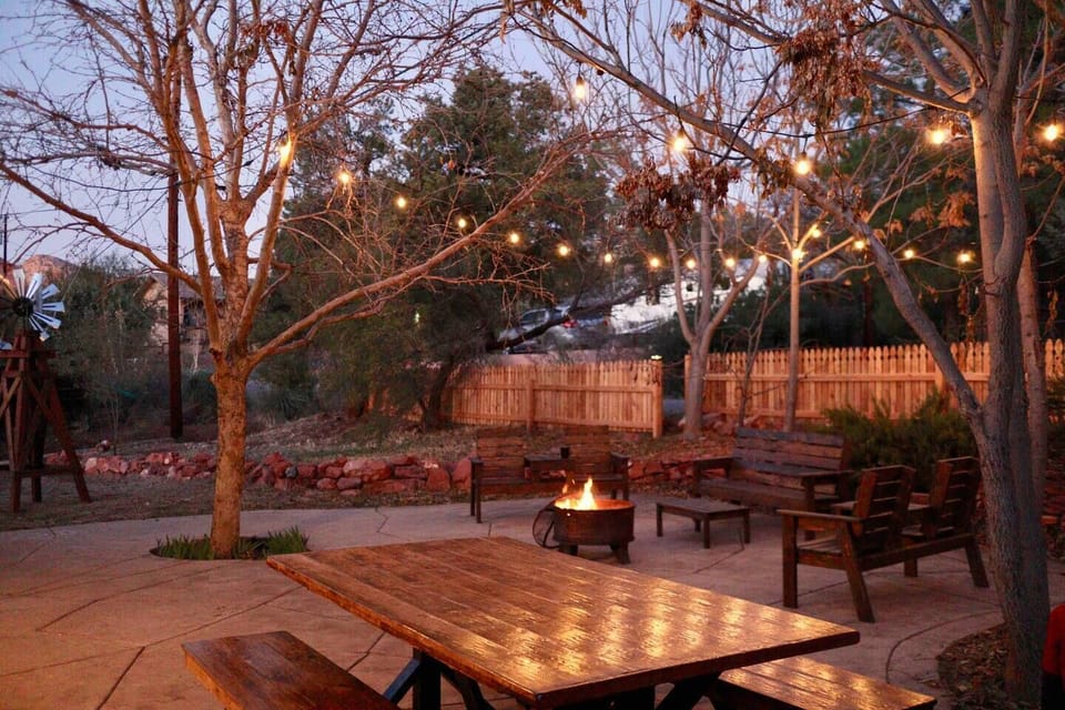 Globe string lights and fire pit provide a relaxing ambiance at night 