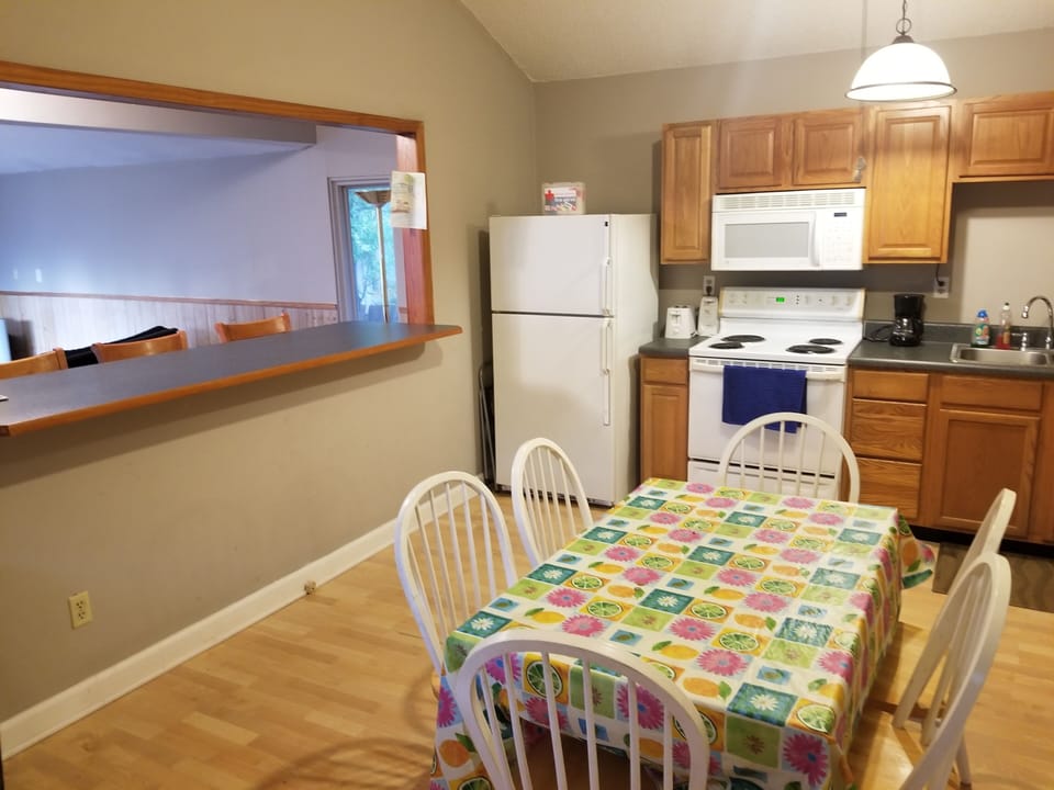 Full kitchen with dining table for 6; seating for 3 more at the breakfast bar.