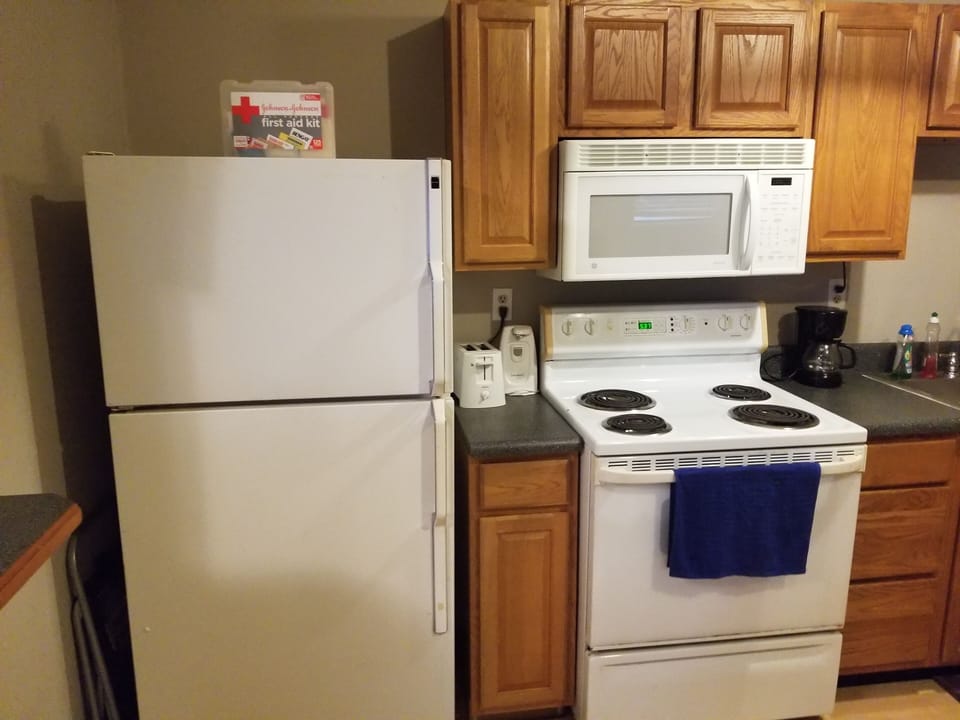 Full size fridge, stove, and microwave.