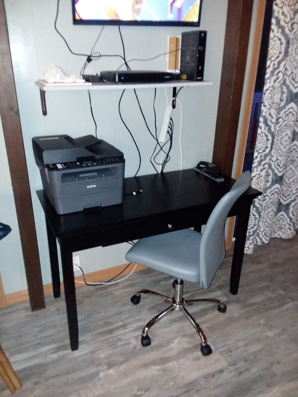 Office area in Living room. Printer is a "Brother MFC-L2710DW"