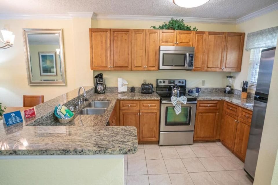 Cook with ease in a fully equipped granite-top kitchen.
