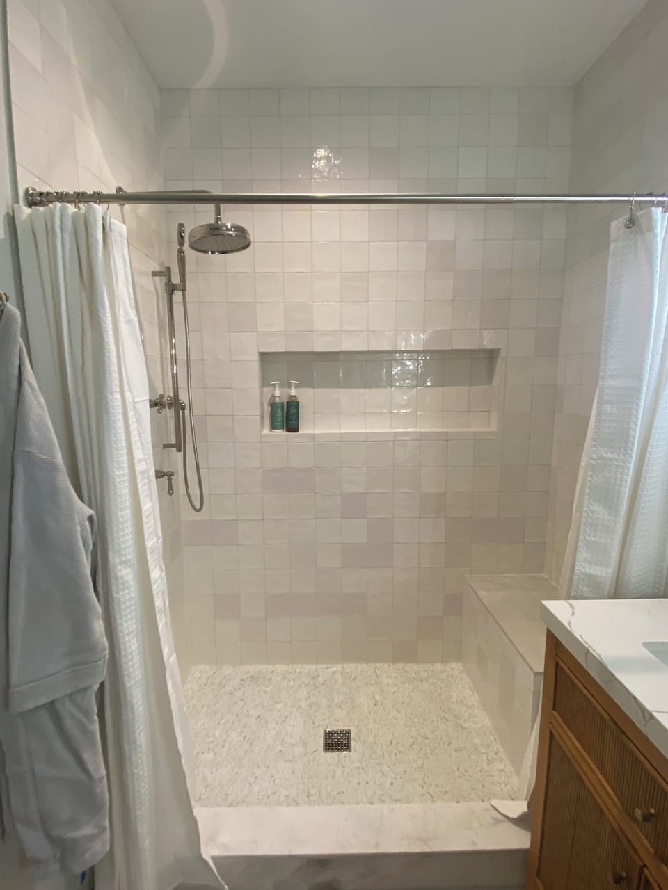 Gorgeous walk in shower with bench in primary en-suite bathroom