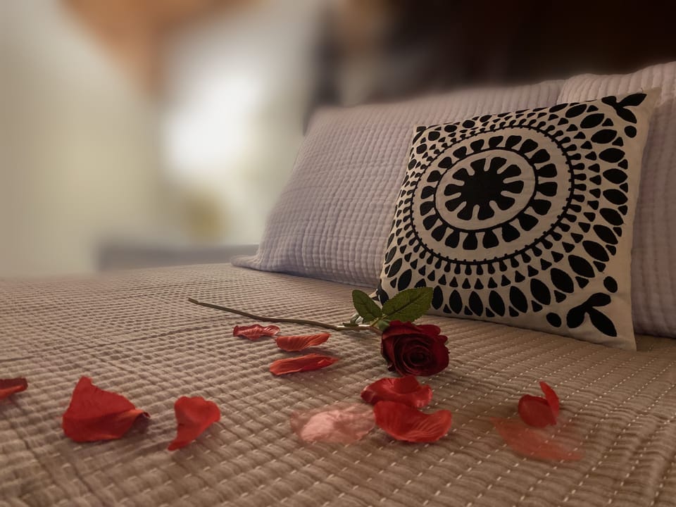 Scattered rose petals are included in our 'With Love' package.
