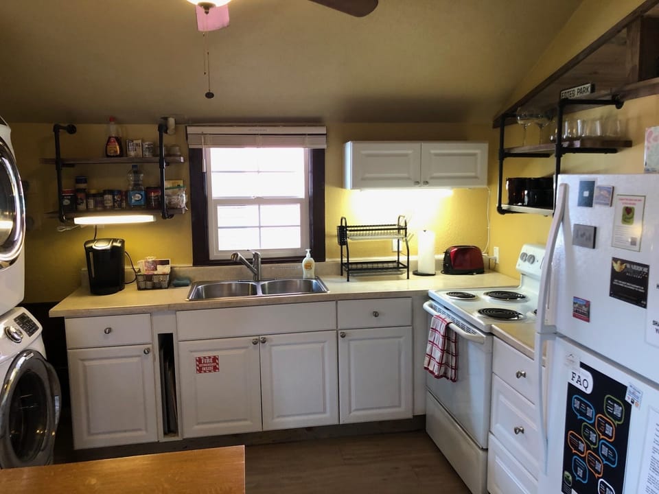 Kitchen makes cooking in the cabin easy. Pots & pans in cabinets