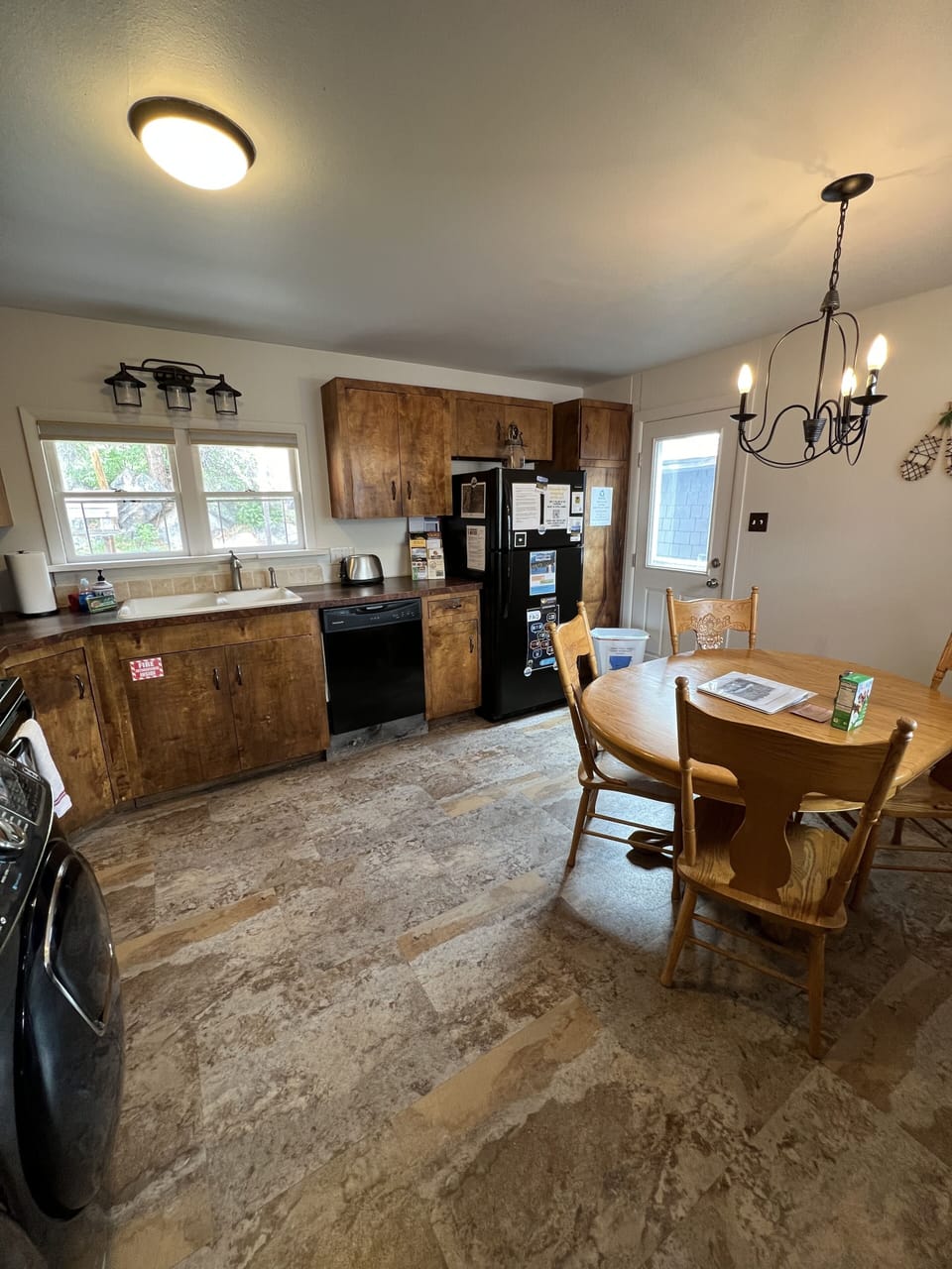 Fully stocked kitchen with full size refrigerator, dishwasher, stove, microwave.