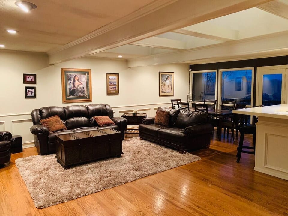 Relax in the open-concept living area with comfy seating and warm, welcoming vibes.