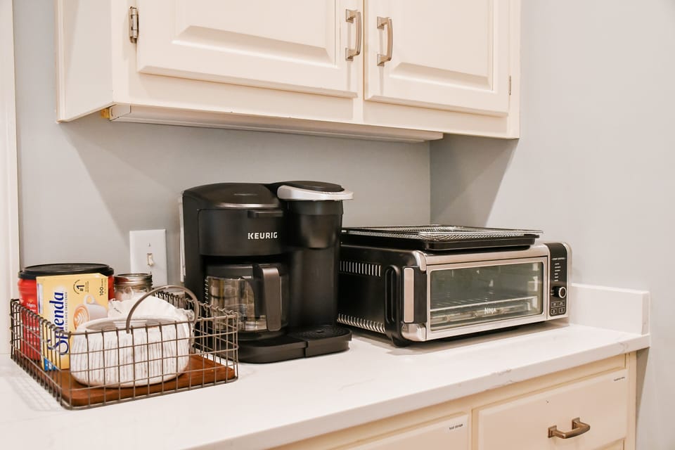 Coffee station has Keurig (K-Cup and ground coffee) and toaster