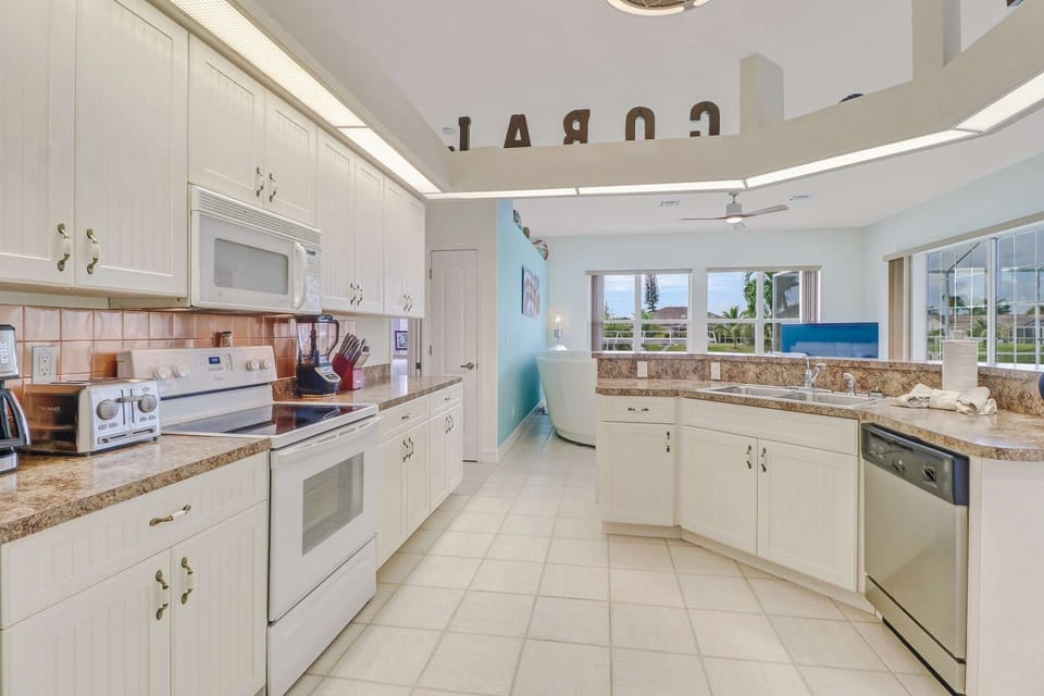 The kitchen features full size appliances, and comes with many small kitchen electrical appliances to make meals prep easy and enjoyable.