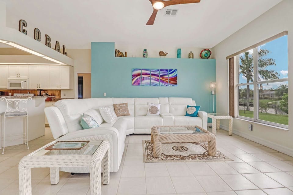 Relax in the open family room area on the spacious sectional sofa with 3 reclining seating areas, perfect for watching the large TV with cable.