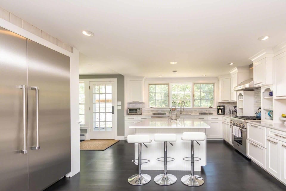 Spacious Kitchen Features Center Island with Breakfast Bar and Professional Quality Stainless Appliances