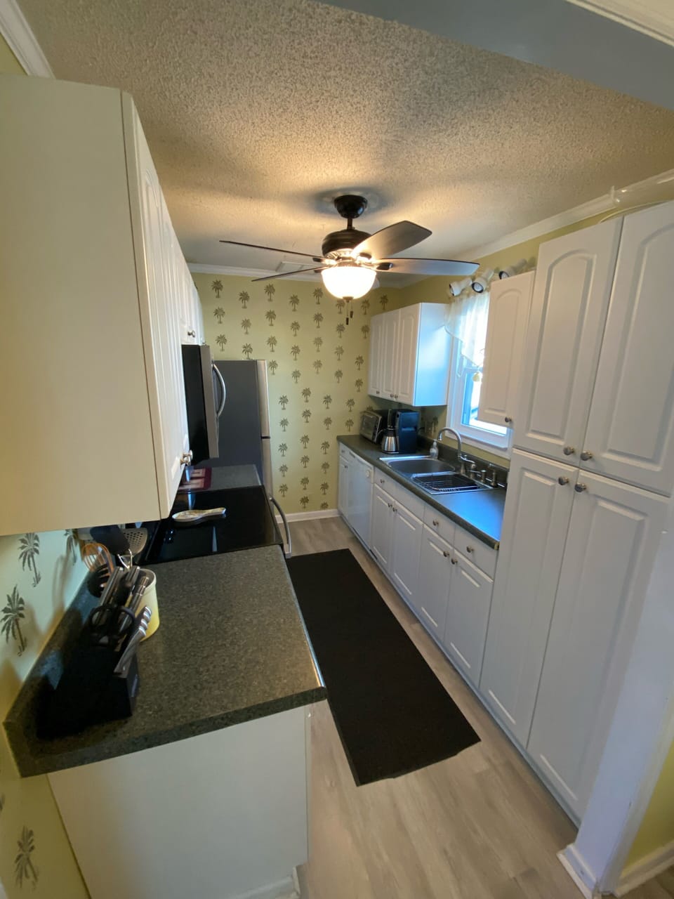 Fully stocked kitchen with new refrigerator, microwave and smooth top stove! 