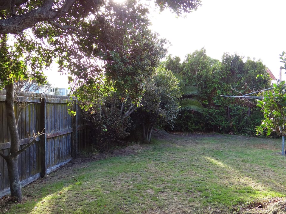 Fenced backyard. Room to park a boat.