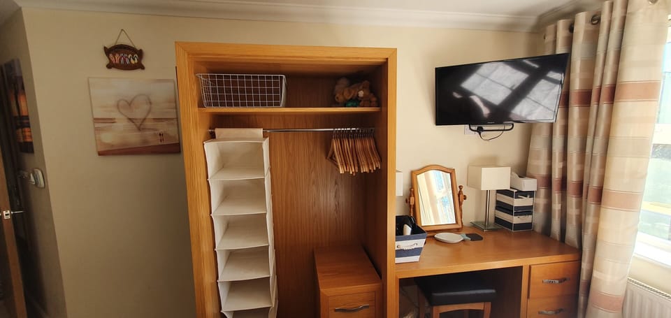 Wardrobe, dressing table and 32inch Sony TV in bedroom 2
