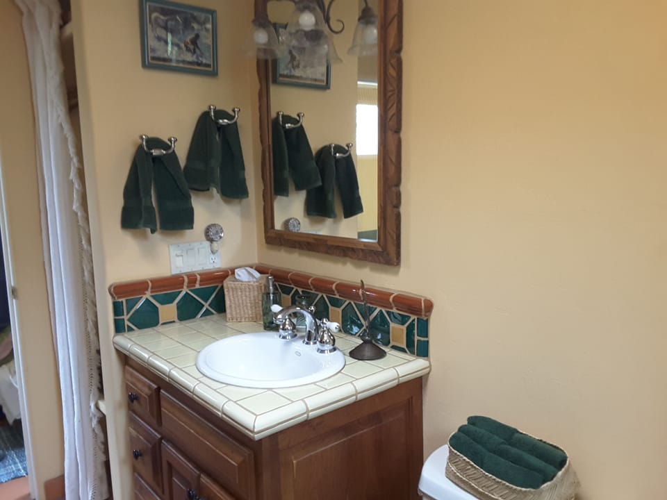Newly remodeled bath with vibrant Mexican tile, a large and deep soaking tub.