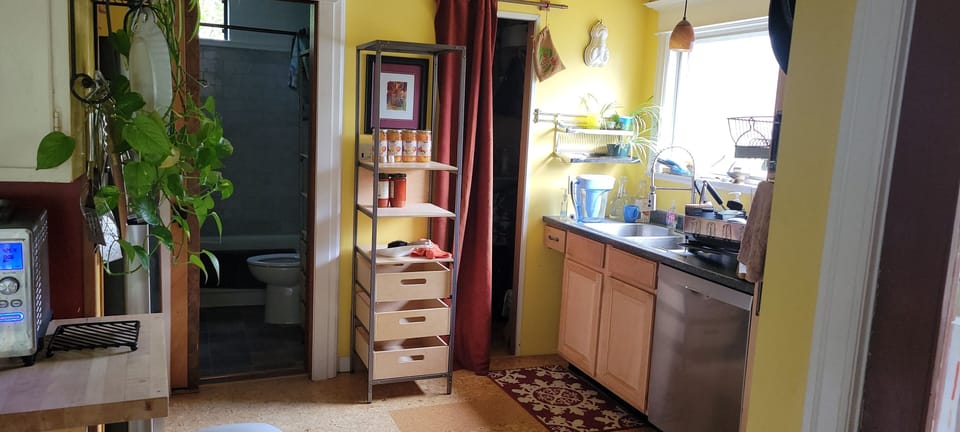 Shelving by kitchen sink