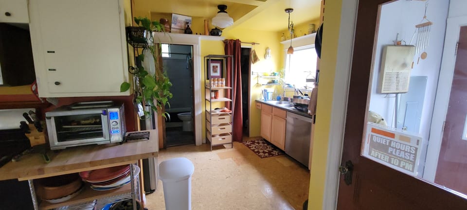 Shelving by kitchen sink