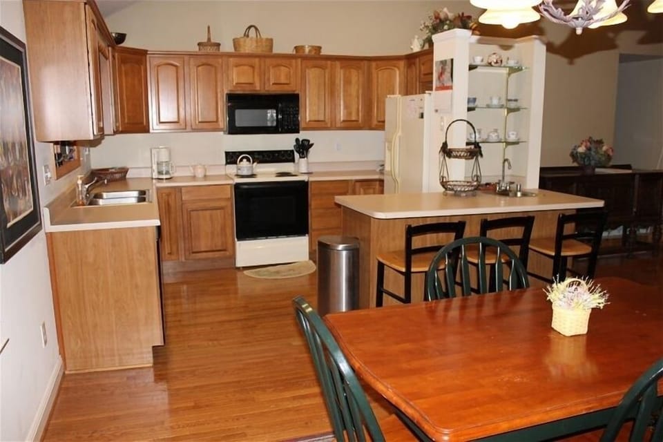 Fully stocked Kitchen with dishes, pots, pans, cutlery & paper products.