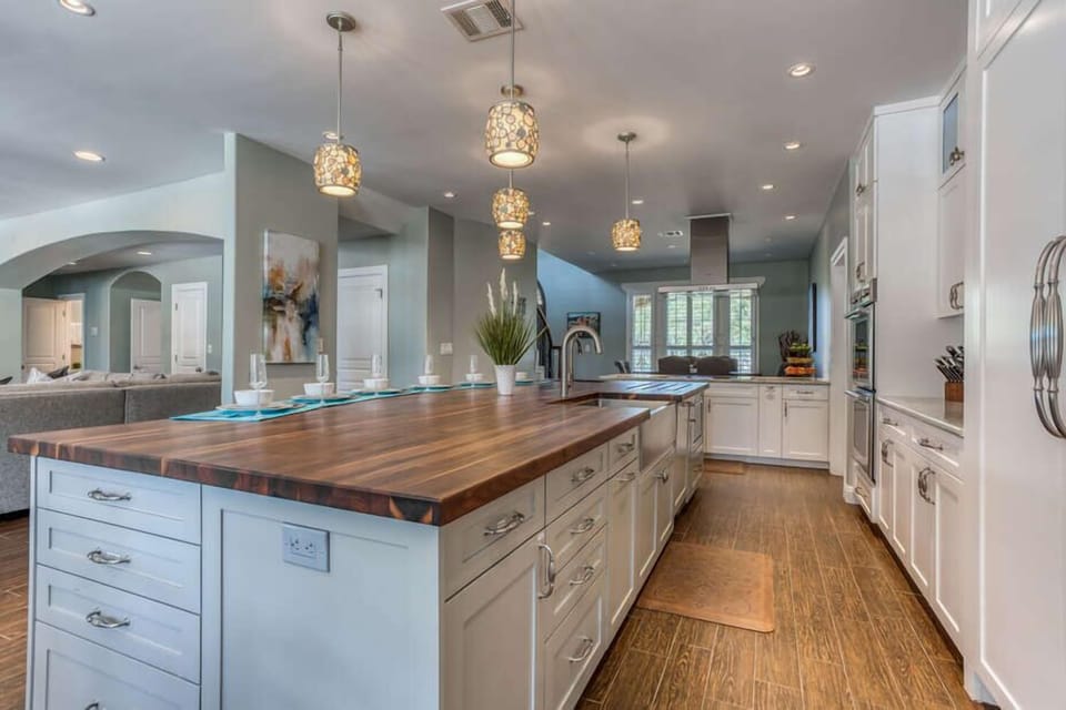 Fully Equipped Gourmet Kitchen with an Expansive Center Island and Side Kitchen Bar, Both with Seating - Great for Entertaining and Meal Prep