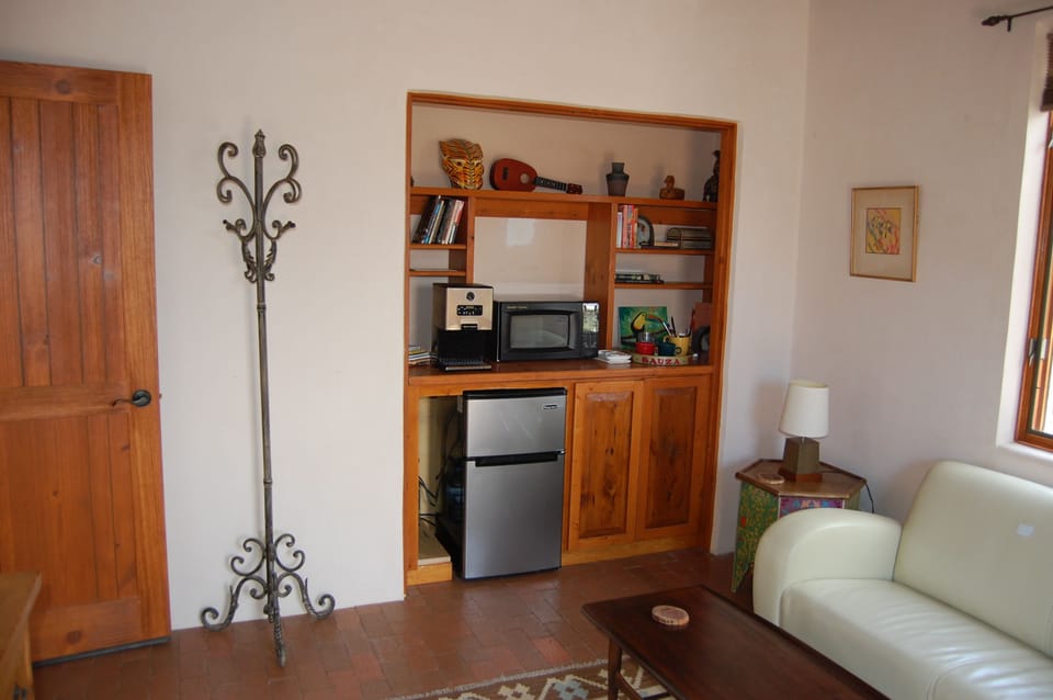 kitchenette with coffee maker, microwave, fridge etc.