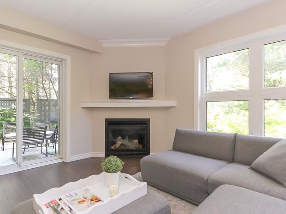 Living room w fireplace and walkout to yard