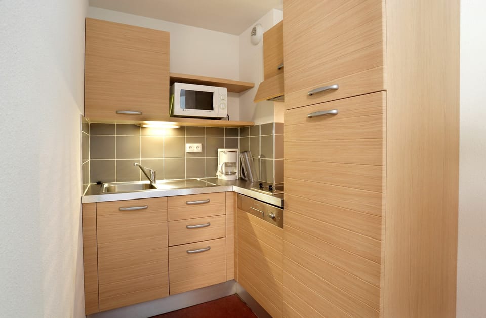 Cook up a small meal in your kitchenette.