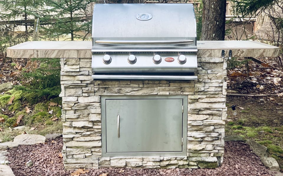 Stone & stainless steel BBQ grill island 