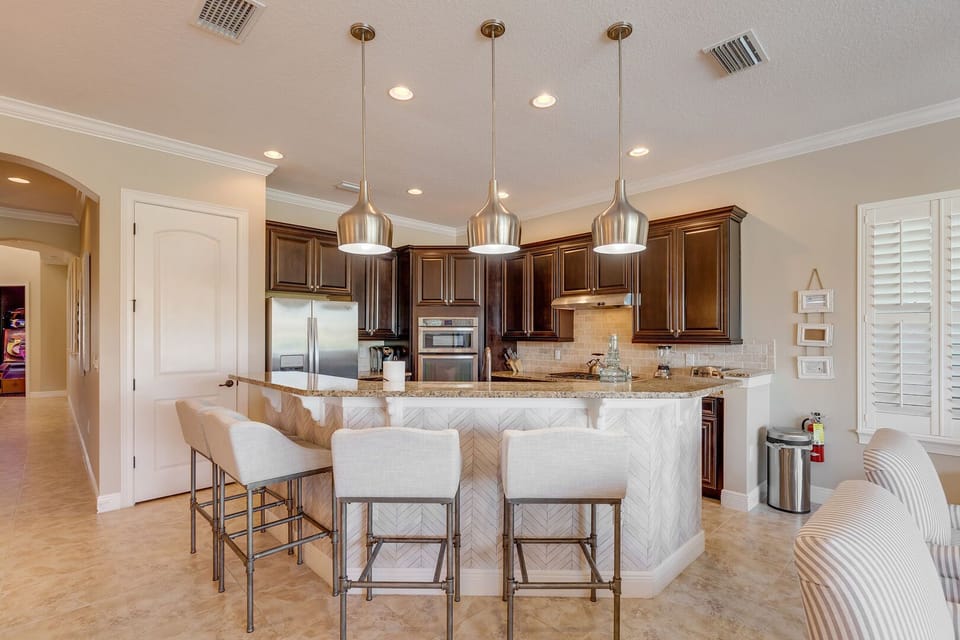 Beautiful fully equipped kitchen with barstool seating