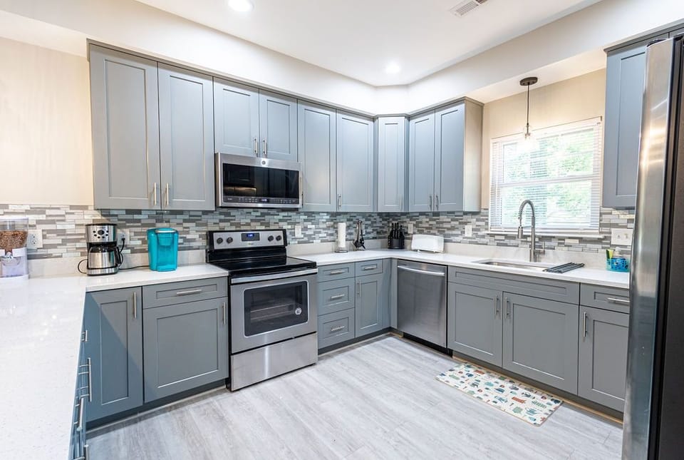 Kitchen with electric range.