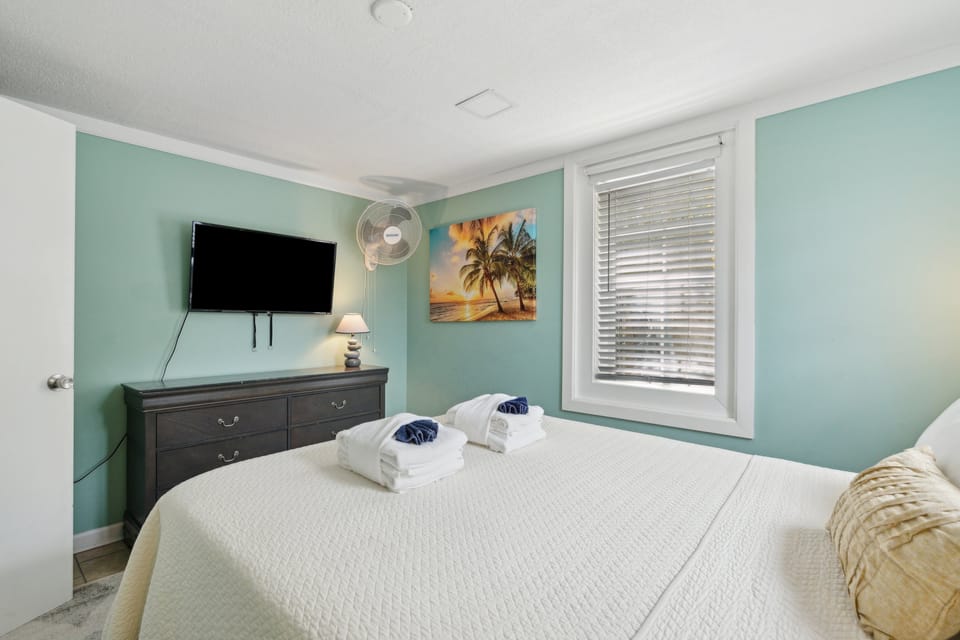 Unwind after a day at the beach in the queen guest room.
