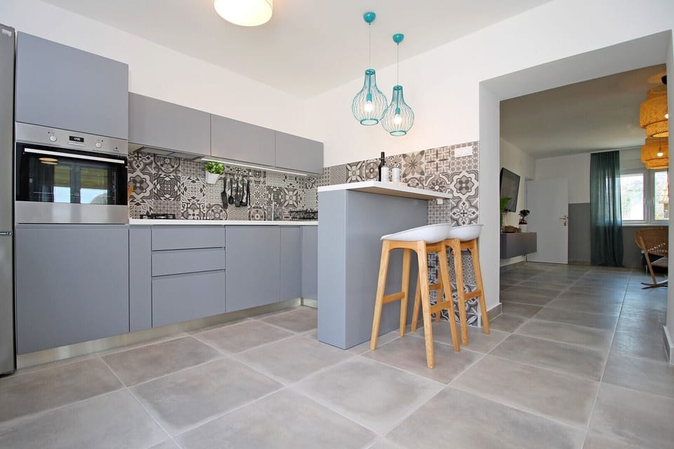 Fully equipped kitchen with dining area&exit to pool area + barbecue&Playground