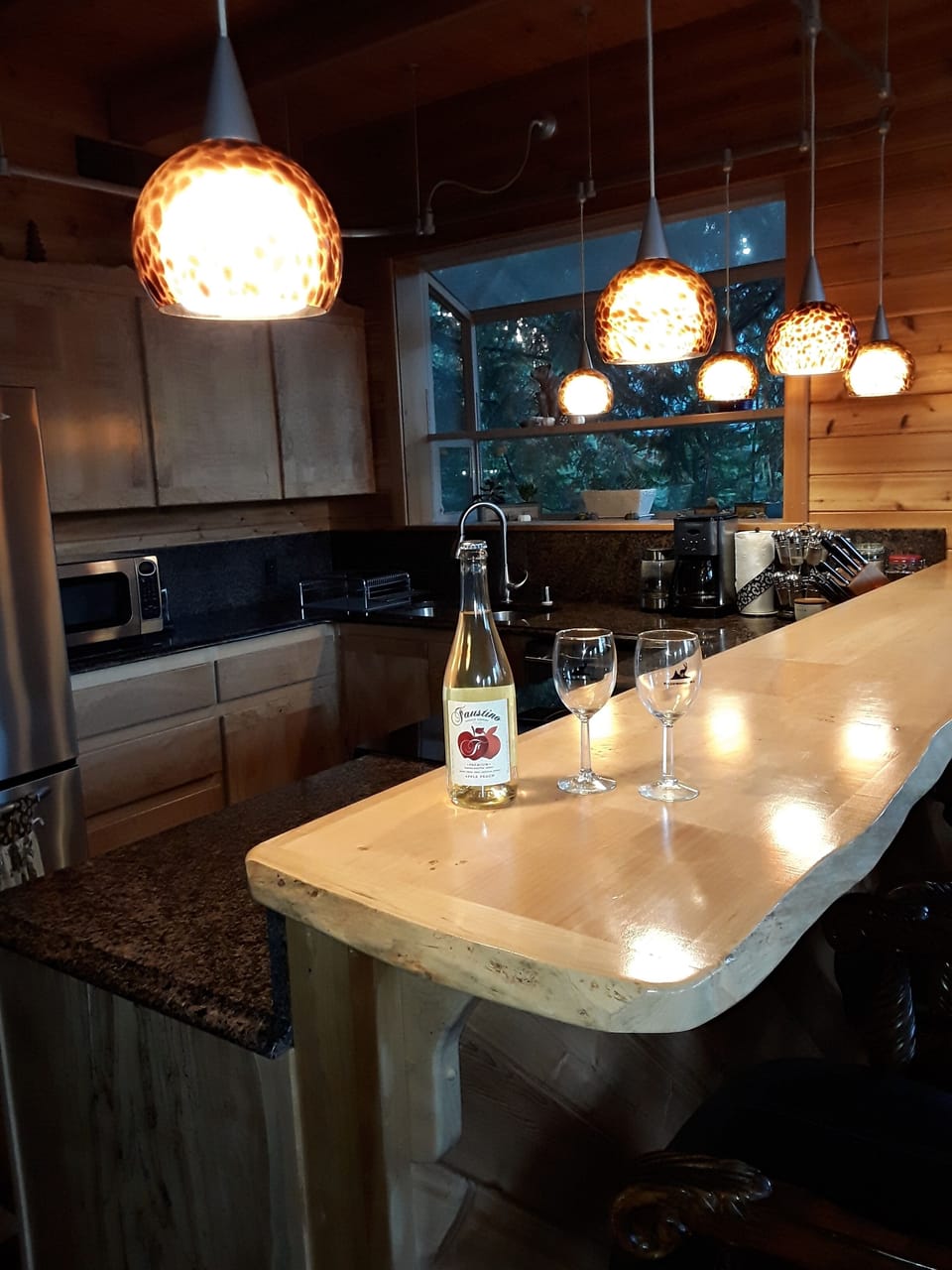 Randlewood spalted maple cabinets and live edge breakfast bar w seating for four