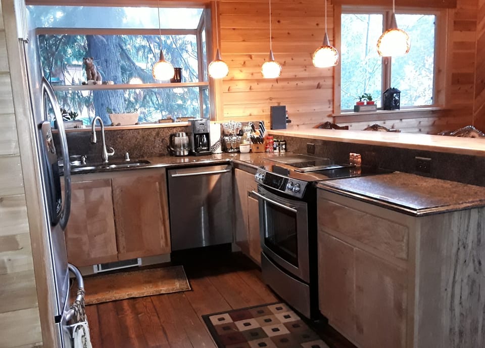 Large modern kitchen with granite countertops and large breakfast bar