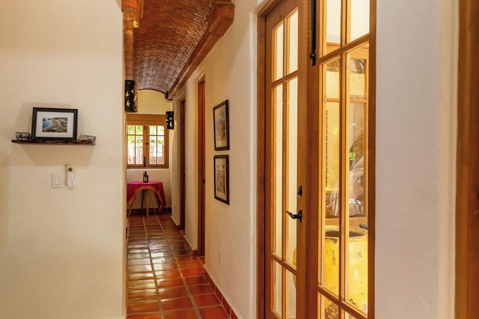 Nicely Decorated Hallway from Living Room to Downstairs Bedrooms