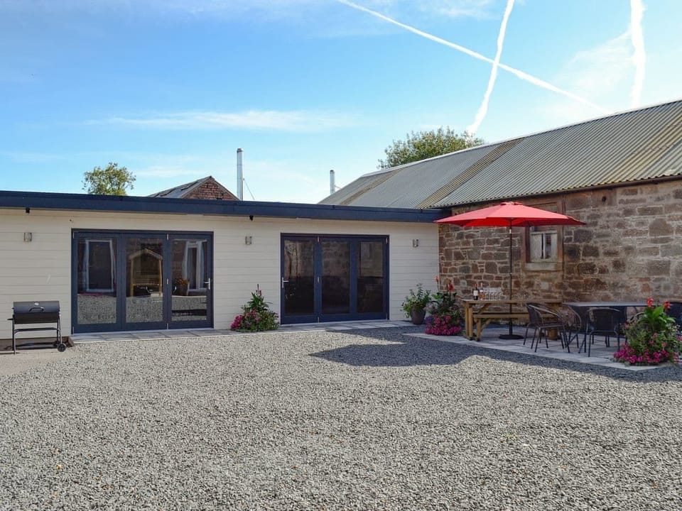 Heated games/cinema room with bi-fold doors.