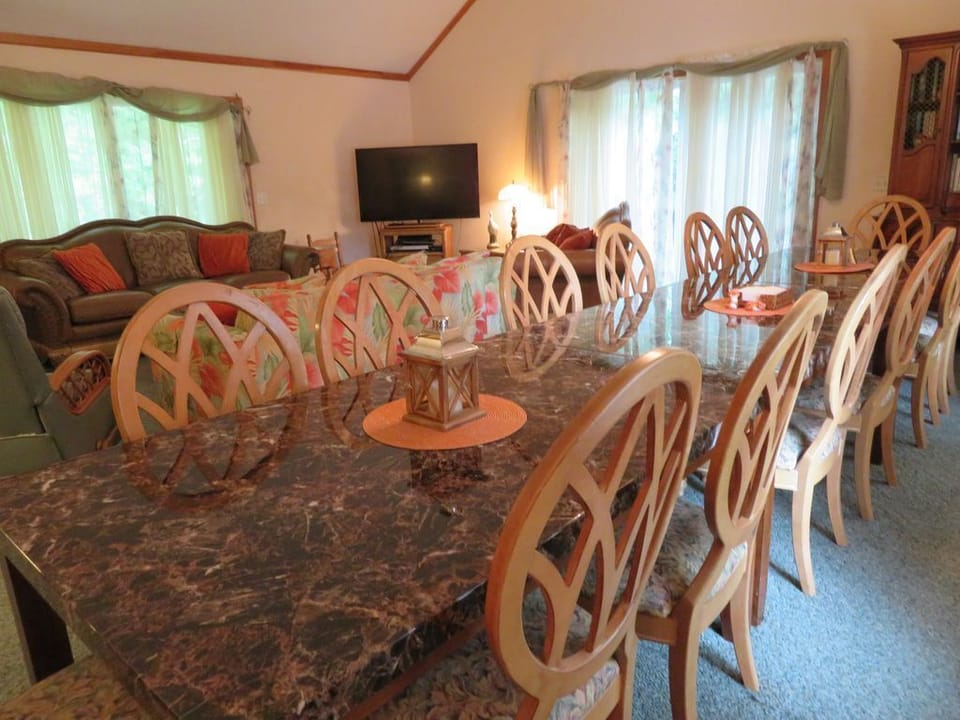 Great room is very large and has a 60 inch TV and a cathedral ceiling