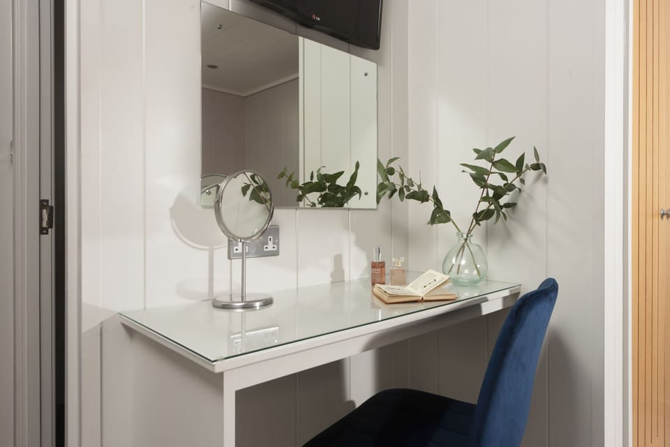 Basin, cabinet, mirror, shaver point within bathroom  - Blackbird Lodge